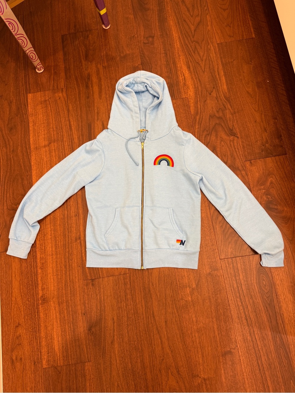 Women’s Light Blue Zip-Up Hoodie with Rainbow Sewn Design - Aviator Nation